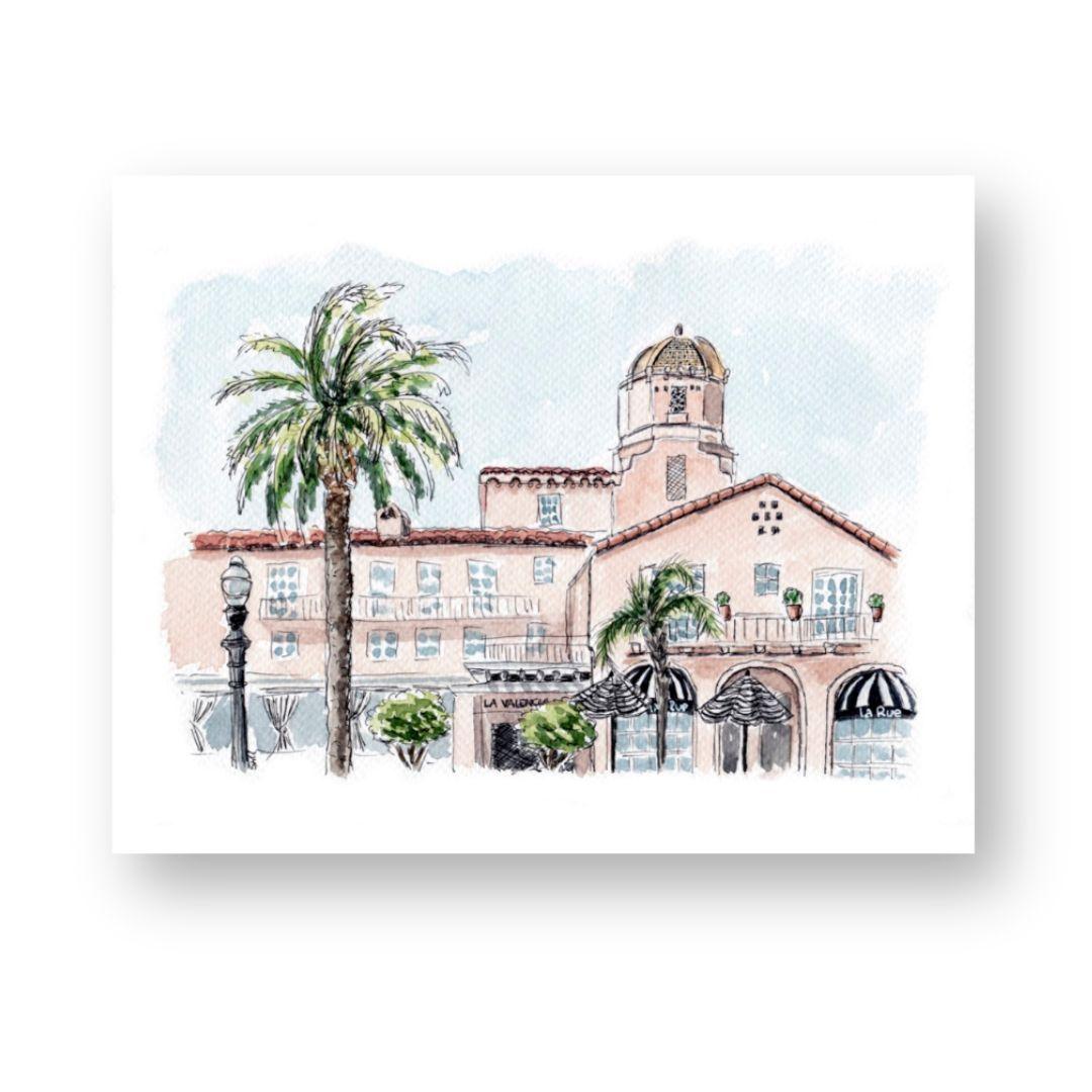 Watercolor painting of La Valencia Hotel, 'The Pink Lady' in La Jolla, featuring palm trees and Spanish Revival architecture. Vibrant coastal California art print by Swil Arts, perfect for home decor. Watercolor wall art featuring La Valencia's iconic dome and terrace