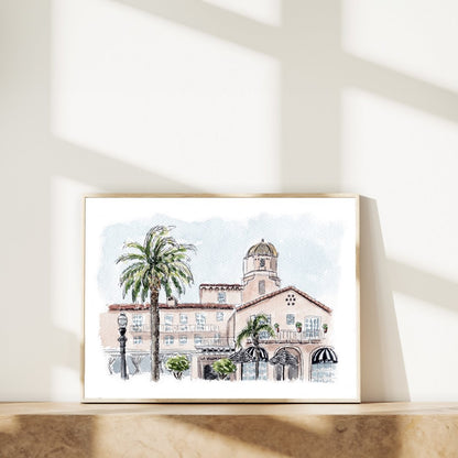 Framed watercolor print of historic La Valencia Hotel in La Jolla, San Diego with palm trees and classic Spanish architecture. Ideal wall art for San Diego enthusiasts and those seeking Mediterranean-inspired decor.